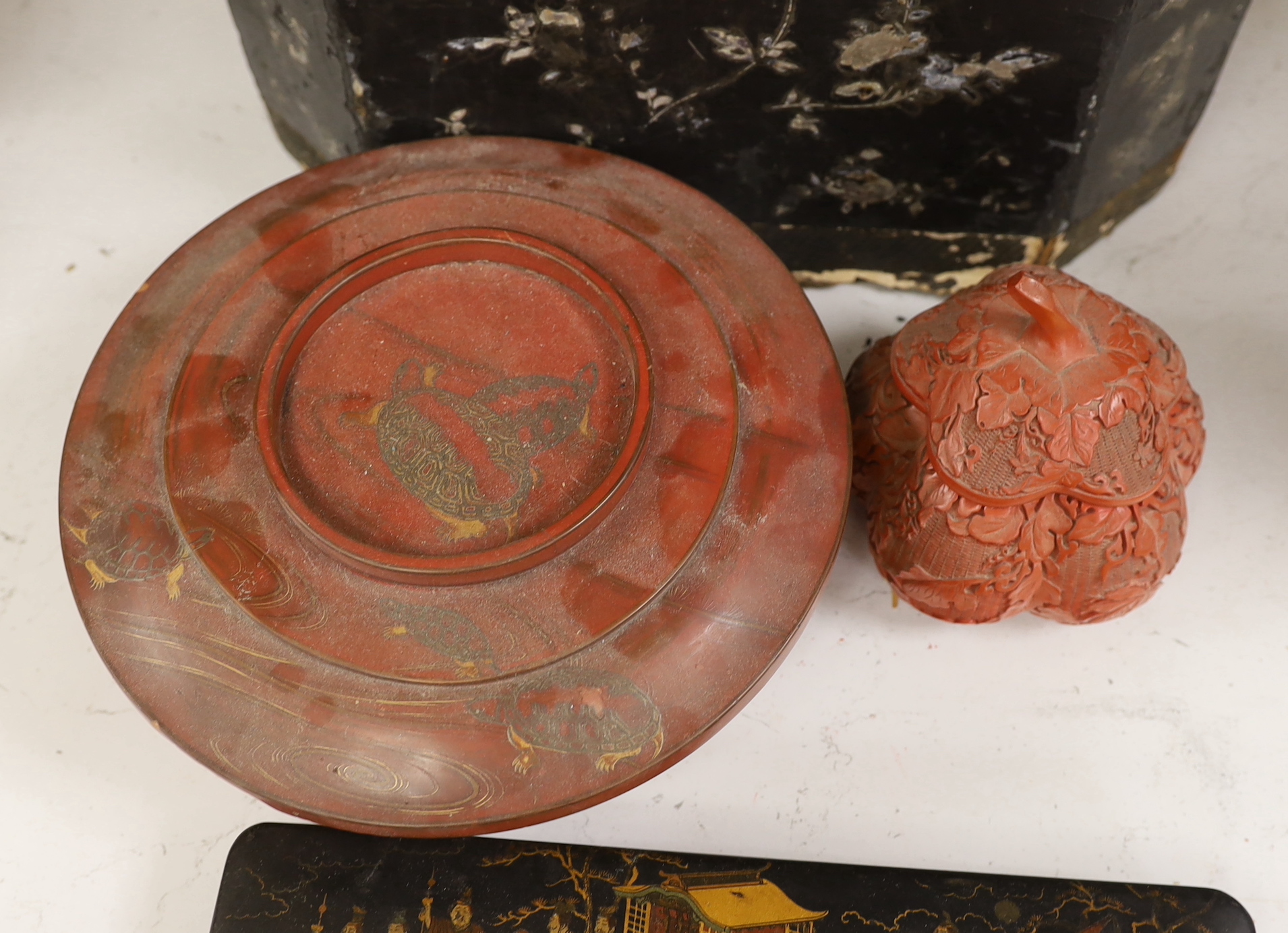 A Chinese black lacquer and mother of pearl box, two red lacquer boxes and a Chinoiserie painted box, largest 28cm wide, 37cm high